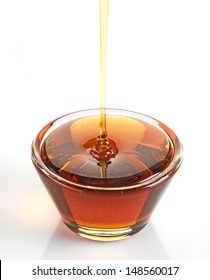 Maple Syrup In A Bowl On White Background