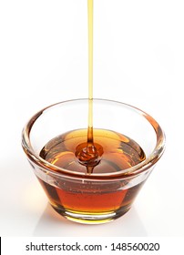 Maple Syrup In A Bowl On White Background