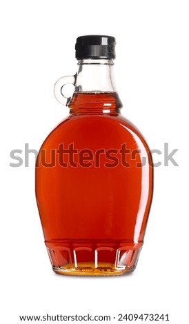 Maple syrup in a glass bottle. Bottled Canadian maple syrup made from the sap of maple trees in which sucrose is the most prevalent sugar. Used in baking, as condiment, sweetener and flavouring agent.