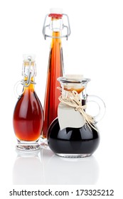 Maple Syrup In Glass Bottle Or Herbal Syrup, Ardent Drink, Mixture, With Heart Label. On White Background.