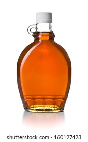 Maple Syrup In Glass Bottle On White Background