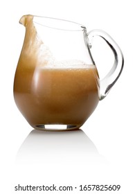 Maple Syrup In Glass Pitcher On White Background