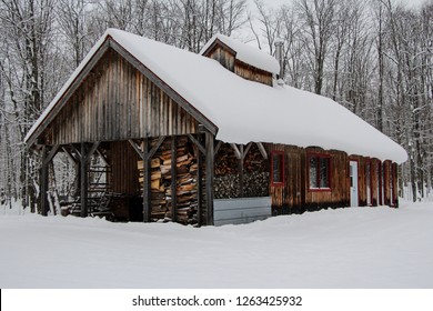 A Maple Syrup Sugar Shack In Rural Quebec Covered In Snow.