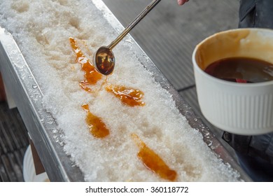 Maple Taffy On Snow During Sugar Shack Period. In Quebec, Canada.