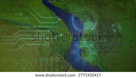 Mapping winding river snaking through green fields, marsh, adding circuit traces, HUD rings, tracks. Aerial, waterway, wetlands, valley, gridlines, overlay, geospatial