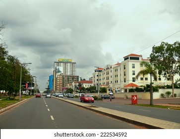 Maputo, Mozambique - December 12, 2008: In The Capital Of Mozambique. City Life. Architectural Structure. Unknown City Residents Go About Their Business. The Road With Cars.