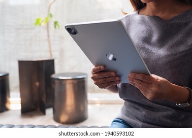 Mar 11th 2021 : A Woman Holding And Using Apple New Ipad Pro 2020 Digital Tablet In Cafe , Chiang Mai Thailand