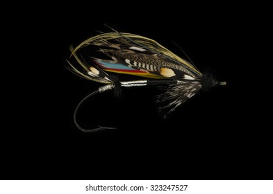 Mar Lodge Salmon Fly Shot Against A Black Background