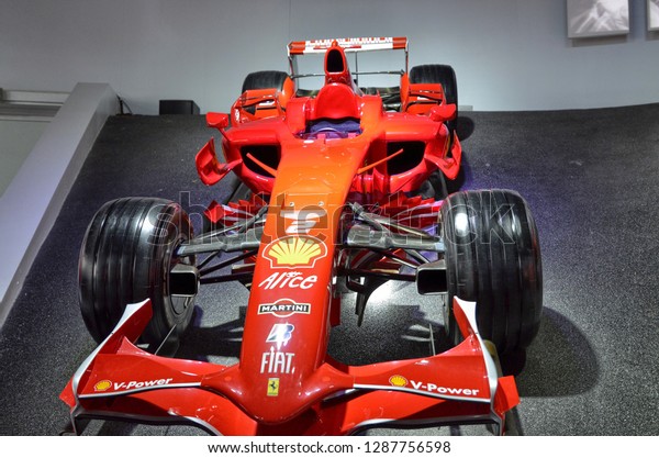 Maranello, Emilia Romagna, Italy. December 2018.\
At the Ferrari museum, the room where the world-class Formula 1\
winning cars are displayed. Videos of those moments flow on a large\
screen.