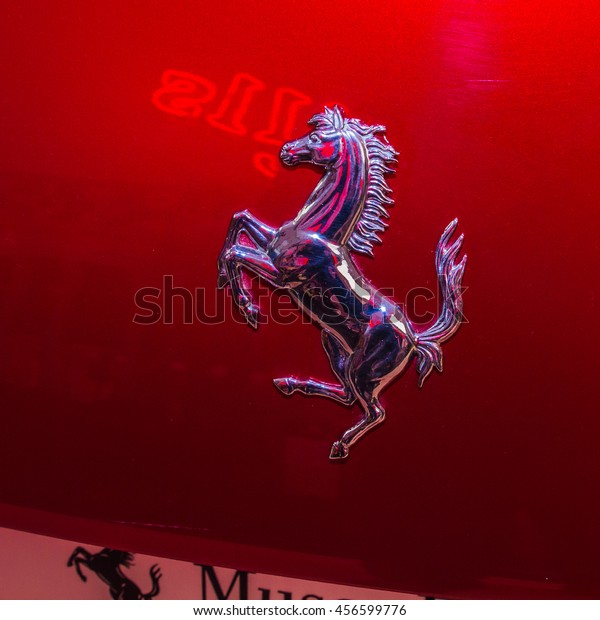 MARANELLO,\
ITALY - APRIL 2015: Museum  Enzo Ferrari. Red Ferrari SA Aperta\
with The Cavallino Rampante, symbol of Ferrari on. The Cavallino\
Rampante (Ferrary horse), symbol of\
Ferrari.