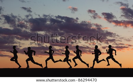 Marathon, black silhouettes of runners on the sunset