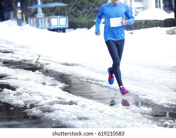 Marathon race on winter street - Shutterstock ID 619210583