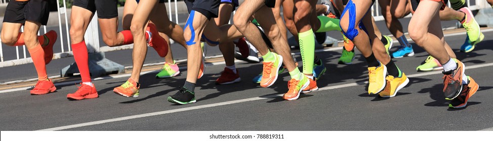 Marathon Runner Legs Running On City Road