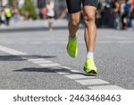 marathon runner with yellow running shoes