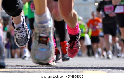 Marathon runners close up legs and shoes