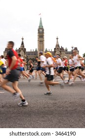 Marathon Runners Passing Parliament Hill. Ottawa, Ontario. Canada.