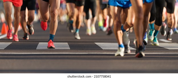 Marathon Runners Running On City Road, Large Group Of Runners