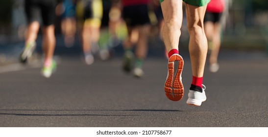 Marathon Runners Running On City Road, Large Group Of Runners