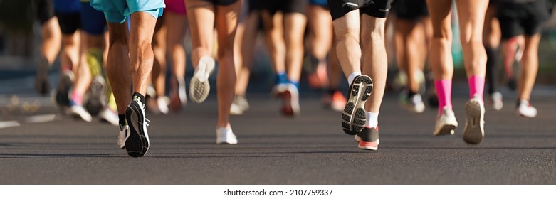 Marathon Runners Running On City Road, Large Group Of Runners