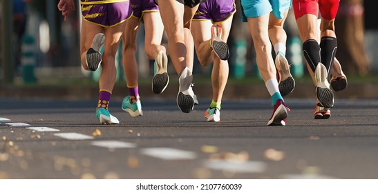 Marathon Runners Running On City Road, Large Group Of Runners