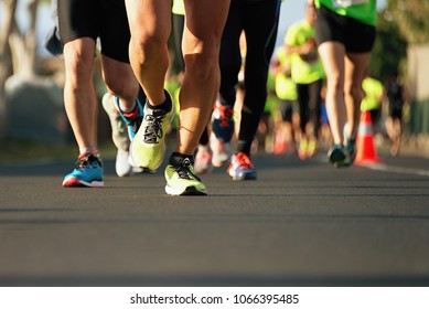 Marathon running in the light of evening - Shutterstock ID 1066395485