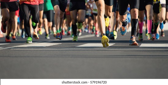Marathon running in the light of evening - Shutterstock ID 579196720