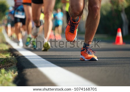 Marathon running in the light of evening