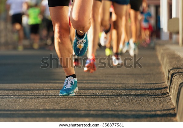 Marathon running in the\
light of evening
