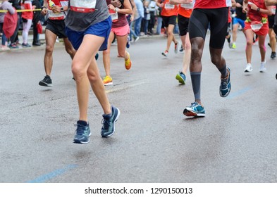 Marathon Running Race, Many Runners Feet On Road Racing, Sport Competition, Fitness And Healthy Lifestyle Concept