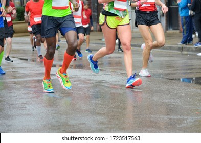 Marathon running race, many runners feet on road racing, sport competition, fitness and healthy lifestyle concept
 - Powered by Shutterstock