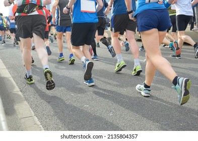 Marathon Running Race, Many Runners Feet On Road Racing, Sport Competition, Fitness And Healthy Lifestyle Concept