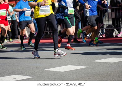 Marathon Running Race, Many Runners Feet On Road Racing, Sport Competition, Fitness And Healthy Lifestyle Concept