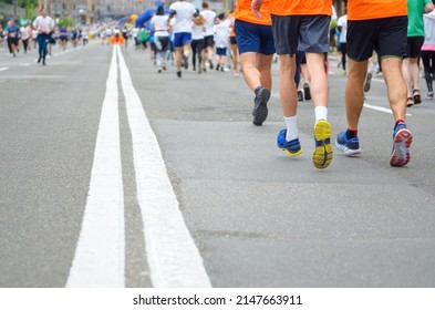 Marathon Running Race, Many Runners Feet On Road Racing, Sport Competition, Fitness And Healthy Lifestyle Concept