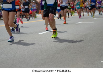 Marathon Running Race, Many Runners Feet On Road, Sport, Fitness And Healthy Lifestyle Concept
