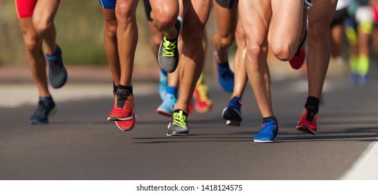 Marathon running race, people feet on city road - Shutterstock ID 1418124575