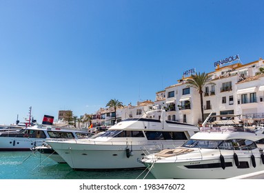 Marbella, SPAIN - July 16 2020: Luxury Puerto Jose Banus Harbour situated in Nueva Andalucia area of Marbella city. Luxury lifestyle with expensive yachts, shopping area with exclusive stores