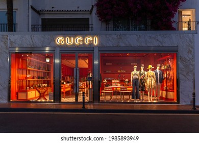 Marbella, SPAIN - July 16 2020 Gucci Store in Puerto Banus shopping area. Famous harbour and luxury shopping area and clubs in Marbella. Night photography