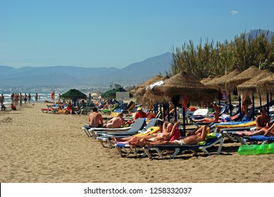 MARBELLA, SPAIN - SEPTEMBER 12, 2008 - View Of Tourists Relaxing On Playa De La Vibora Beach, Elviria, Marbella, Malaga Province, Andalusia, Spain, Western Europe, September 12, 2008.