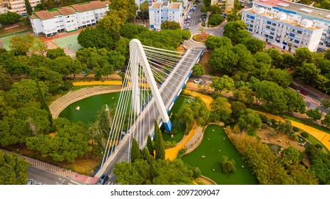 Marbella,Spain,Costa Del Sol. Aerial Photo From Drone To Modern Suspension Bridge  And Represa Park On The Edge Of The Old Town Of Marbella. (Series)