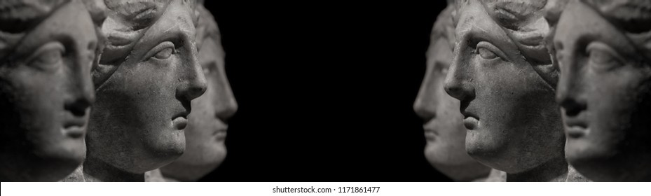 Marble ancient heads of women watching each other in a isolated black background streamer - Shutterstock ID 1171861477