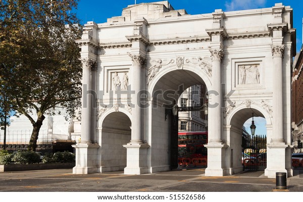 The Marble Arch is a white  triumphal arch and\
London landmark.Historically, only members of the Royal Family and\
the King\'s Troop , Royal Horse Artillery are permitted to pass\
through the Arch.