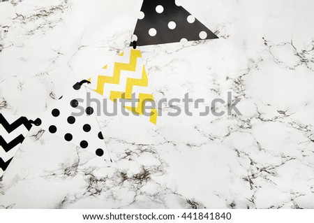 Marble background and decor flags. Party desktop. flat lay