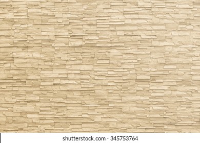 Marble brick stone tile wall texture background in light beige yellow cream color