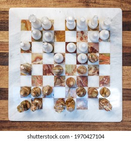 Marble Chess Board On Wood Table