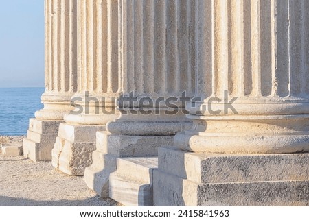 Marble columns with bases. Close up fragment. Corinthian order. Ruined temple of Apollo in Ancient Side (Turkey, Turkiye). History, art or architecture concept