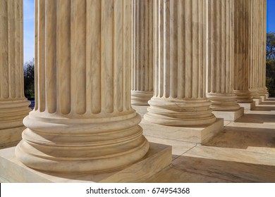 The marble columns of the main portico at the Supreme Court on a sunny spring day in Washington DC, USA - Shutterstock ID 674954368