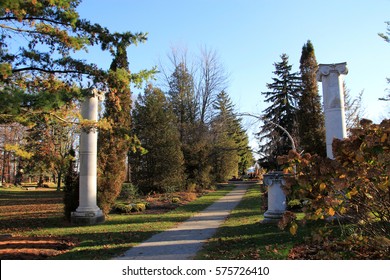 Marble columns in the park at fall