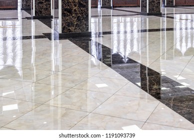 Marble floor in luxury lobby of office or hotel. Clean floor tile with reflections for background. Shiny stone floor in commercial building after professional cleaning service. - Shutterstock ID 1191093739