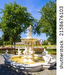 Marble fountain near Palace building of the medieval Dubno Castle. Travel destinations in Ukraine. Scenic view of the castle, which was founded by Konstantin Ostrogski.