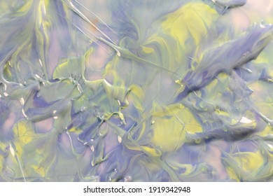 Marble gradient in shades pastel yellow  blue   lilac color  abstract background from mixed nail polish